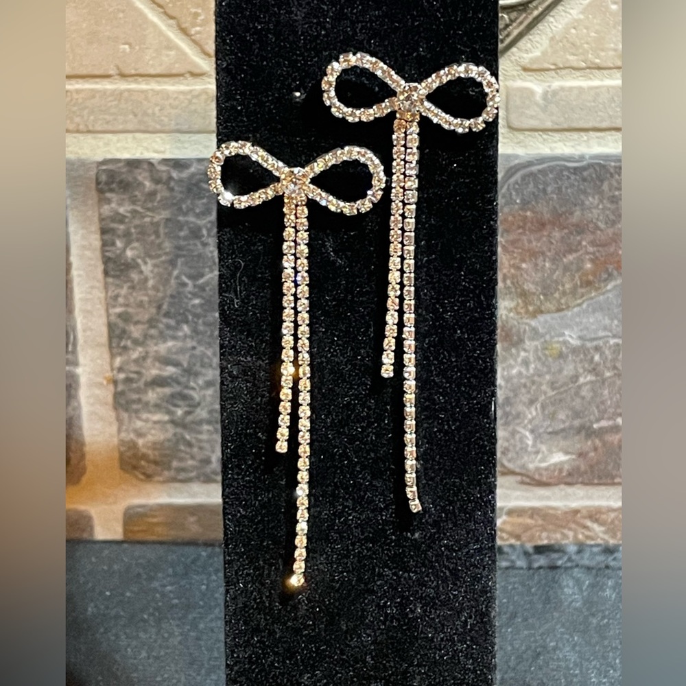 NWT bow rhinestone post earrings with two sets of backings.